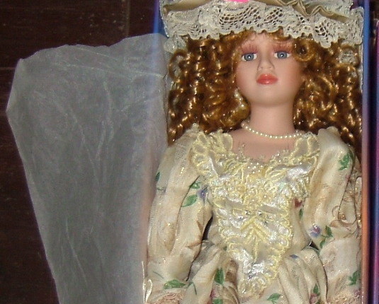 porcelain doll new in box with curly hair beige flower dress - $21.00