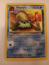 Pokemon 1999 Fossil Series Omanyte 52 / 62 NM Single Trading Card - $9.99