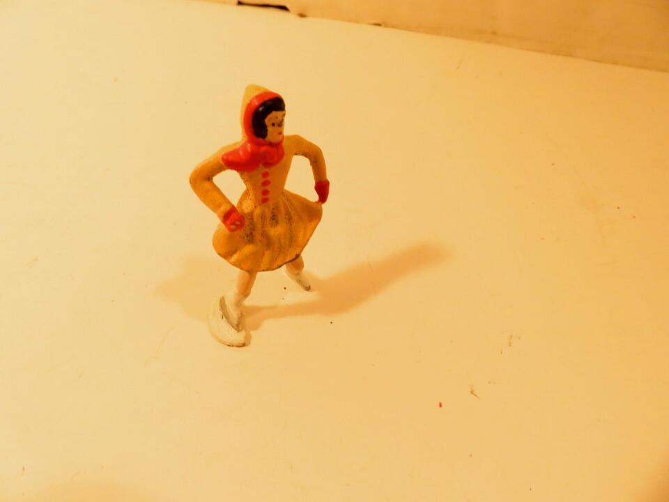 METAL FIGURE -ICE SKATER WOMAN W/YELLOW OUTFIT - GOOD-  2 1/2&quot; -  H12 - $3.75