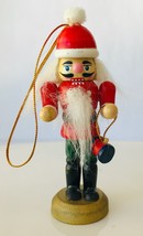 Wood Nutcracker Christmas Ornament Santa Holding Something 3.25&quot; Tall - £9.30 GBP
