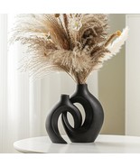 A Pair Of Snuggle Hollow Modern Ceramic Vases In A Matte Black Color, Me... - $61.65 CAD