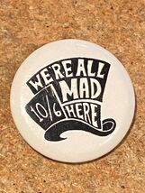 1.25" We're All Mad here 10/6 Hat Shape Button Pinback *Pre-Owned* DTA - $7.99