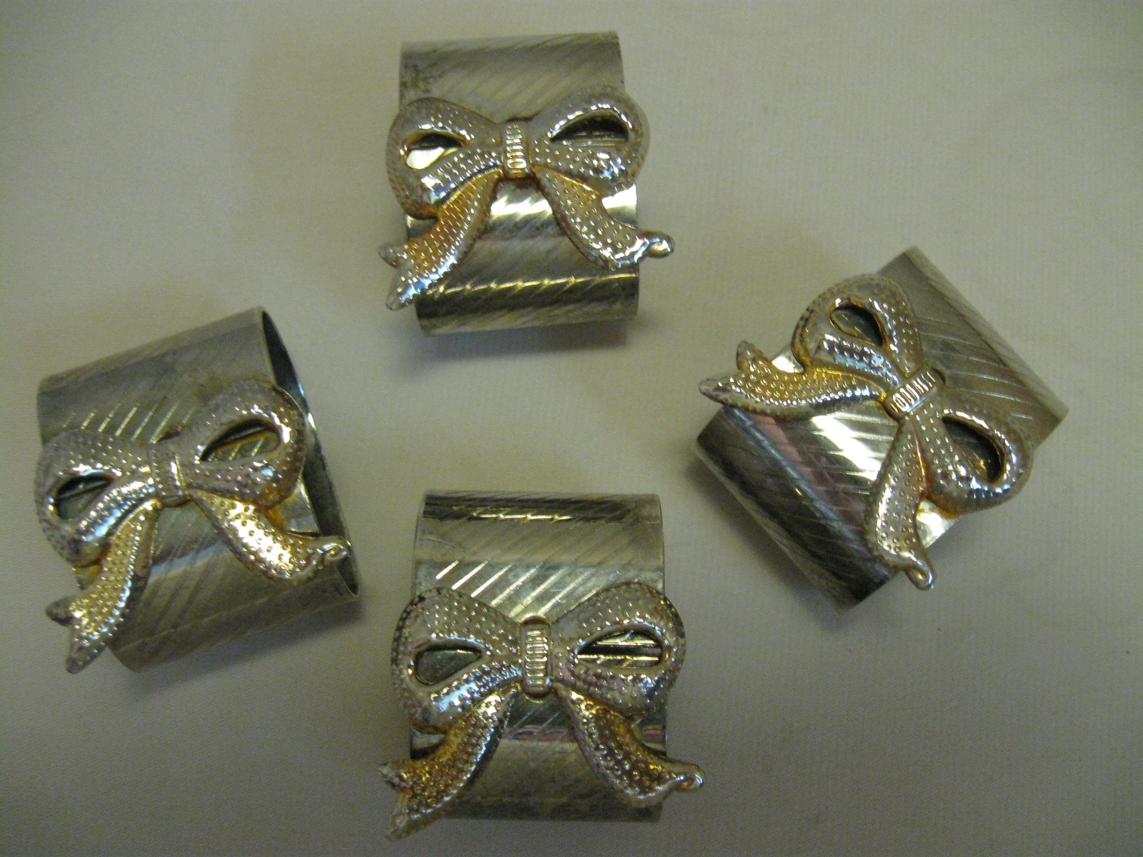 Primary image for Silver Plate or Tone Napkin Holder Rings With Gold & Silver Color Bows Rib Desig
