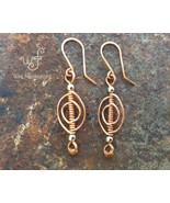 Handmade copper earrings: oval coil wire wrap with silver metal beads - €23,11 EUR