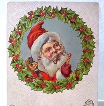 Christmas Postcard Santa Claus Pipe &amp; Candy Cane Behind Decorated Wreath Emboss - £8.54 GBP