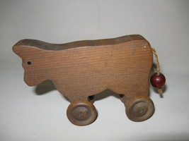 Figurine Cow Rolling Wheels Wood Hand Carved  - £6.22 GBP