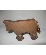 Figurine Cow Rolling Wheels Wood Hand Carved  - £6.35 GBP