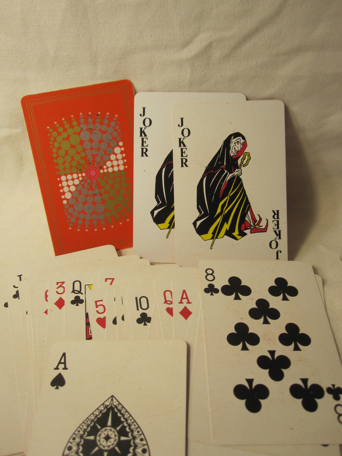 Primary image for vintage Whitman Playing Cards w/ Case - Orange w/ Circles + Devil Joker