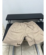 ASOS DESIGN swim shorts in mid length in brown - $19.24 CAD
