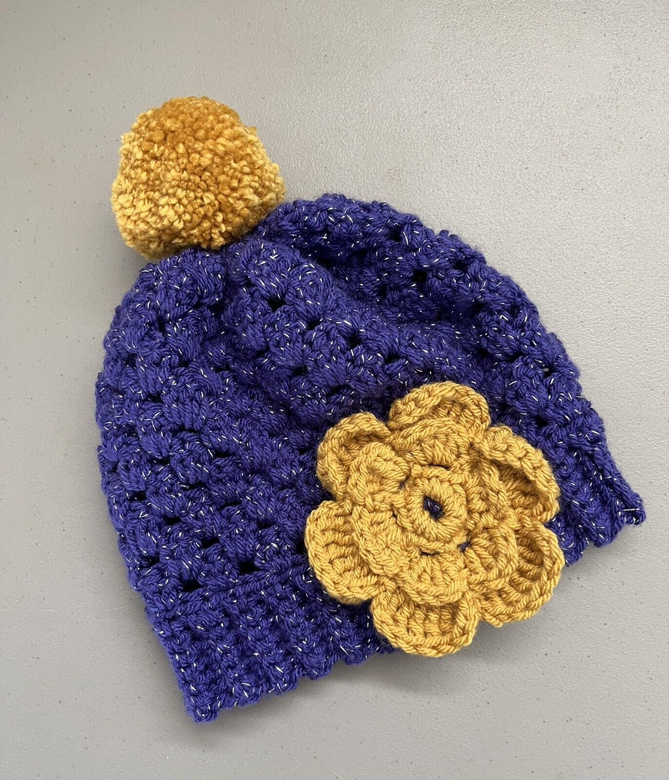 Handmade Crocheted Purple Hat With Gold Flower And Gold PomPom - $12.00