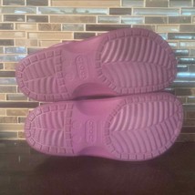 Used purple crocs with fur lining inside - $41.38