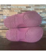 Used purple crocs with fur lining inside - $56.59 CAD