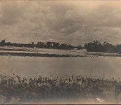 c1910 RPPC Swampy Waterway Foreboding Clouds Divided Back Real Photo Postcard - £7.95 GBP