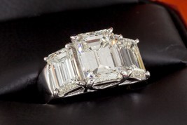 Authenticity Guarantee 
7.66 carat Emerald-Cut 3-Stone 18k White Gold Diamond... - £54,841.41 GBP