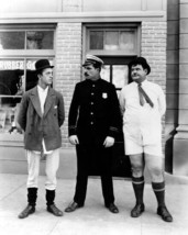 Laurel and Hardy stand without pants on next to policeman 11x17 Poster - £15.76 GBP