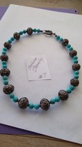 Silver floral balls and simulated turquoise beads a handcrafted necklace... - $15.00