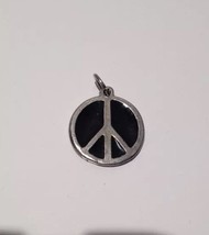 black and silver toned peace sign pendant - £38.82 GBP