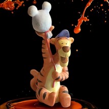 Walt Disney 4&quot; Ceramic Tigger Figurine holding a Mickey Mouse Balloon - £7.90 GBP