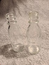 2 Small Clear Glass Deco Bottles  very good condition about 4&quot; tall and 1 &quot; wide - $5.89