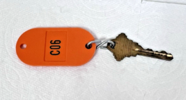 Vintage Hotel Motel Room Key Bright Orange Room C06 Unknown Company - $12.38