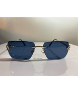 Unisex, rimless, polygonal sunglasses with navy blue lenses and gold wir... - $14.03 CAD
