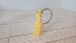  VINTAGE DOUGLAS DIRTWALKER TUPPERWARE KEYCHAIN KEY CHAIN ring YELLOW DI... - £5.51 GBP