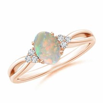 Authenticity Guarantee

Solitaire Oval Opal Split Shank Ring with Trio Diamon... - £658.55 GBP