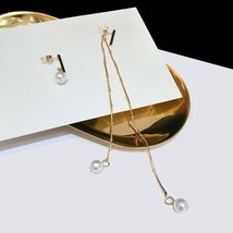 Golden Dangler Pearl Accent Earrings - $71.57 MXN+