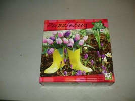 Puzzlebug 500 Piece Puzzle - Yellow Boots in the Garden - Brand New, Sealed - $7.91