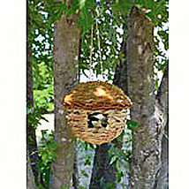 Round grass birdhouse - $208.44 MXN