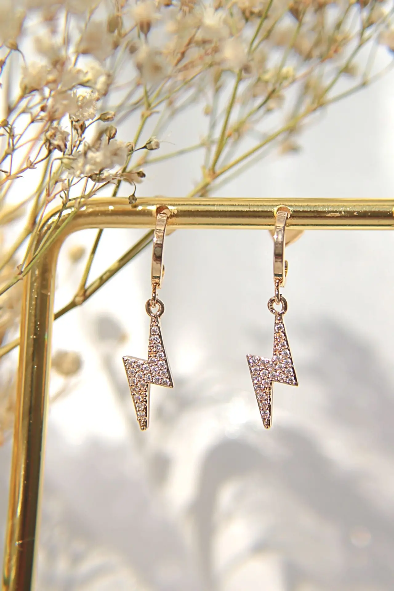 Stormy 24K Gold CZ Lightning Bolt Earrings - Hypoallergenic and Waterproof - $797.92 MXN