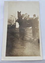 Vintage RPPC of Young Child on Horse Being Pulled by Two Men - £10.03 GBP