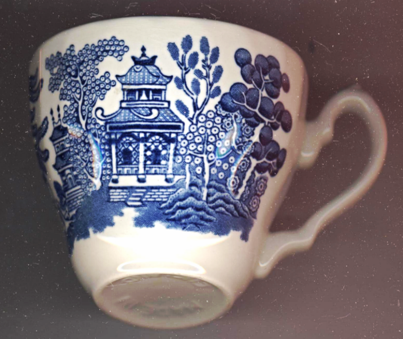 Staffordshire Porcelain China Blue Willow Teacup Made In England Ornate Handle - $6.50