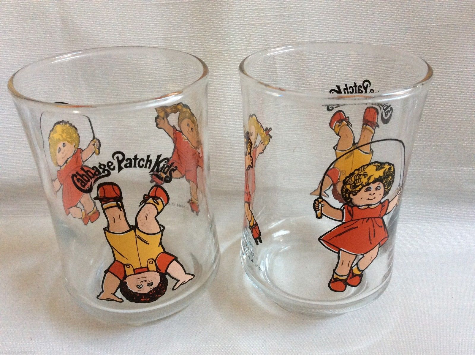 1984 set of 2 Cabbage  Patch Kids Clear Juice Glass Children Play Jump Rope - $29.70