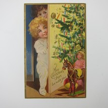 Christmas Postcard Children Behind Door Tree Candles Toys Gold Embossed Antique - £10.22 GBP