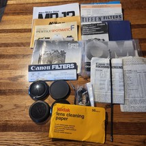 VTG Lot of 35mm Film Camera Manuals, Lens Covers,2 shutter triggers  Can... - $19.80