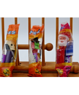 PEZ Witch w/green face &amp; Skull w/purple base + Santa Claus.  New in package - $27.08 CAD