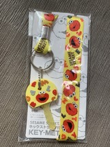 Sesame Street Cookie Monster Sesame keymet with neck strap - $410.07 MXN