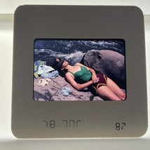 35mm slide Woman Sunbathing On Rocks In Swimsuit July 1980 - $192.73 MXN