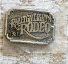 RALEIGH LIGHTS RODEO solid brass belt buckle 1981 New Old Stock in Package - £13.69 GBP