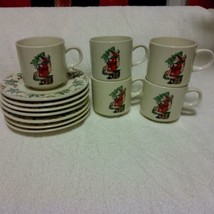 Gibson Housewares GID17 Santa and Holly 5 cups/mugs and 7 saucers, - $35.00