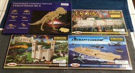 Lot of 4 Large Wood Puzzle 3D Kits Train Aircraft Carrier Castle Tyrannosaurus - £42.12 GBP