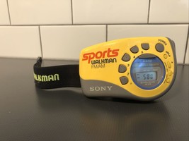 Sony Walkman Yellow FM/AM Sports Radio SRF M78 With Slap Wrist Arm Band Strap - $17.00