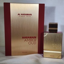 Amber Oud Rouge by Al Haramain Men 2 oz Eau De Parfum Spray - £41.98 GBP