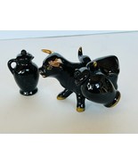 Salt Pepper Shakers vtg figurines 1950s Japan Black Gold Bull Cow saddle... - £35.56 GBP