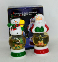 Pair Of Santa Claus And Snowman Figural Snow Globes Salt And Pepper Shak... - $9.95