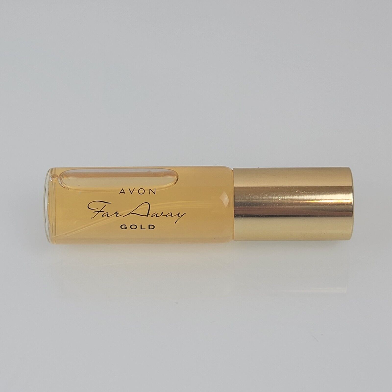 Primary image for Avon Faraway Gold eau de parfum spray .5 fl. oz. Travel Size