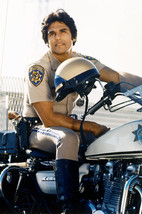 Erik Estrada in CHiPs sitting astride police motorbike 18x24 Poster - $23.99