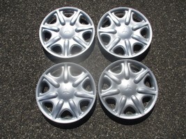 Genuine NOS 1996 to 1998 Mitsubishi Galant 14 inch hubcaps wheel covers - $69.78