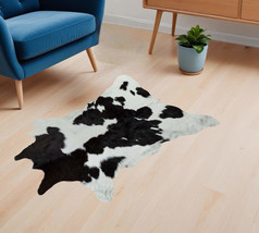 2&#39; X 3&#39; Black and White Cowhide Hand Woven Area Rug - $107.95